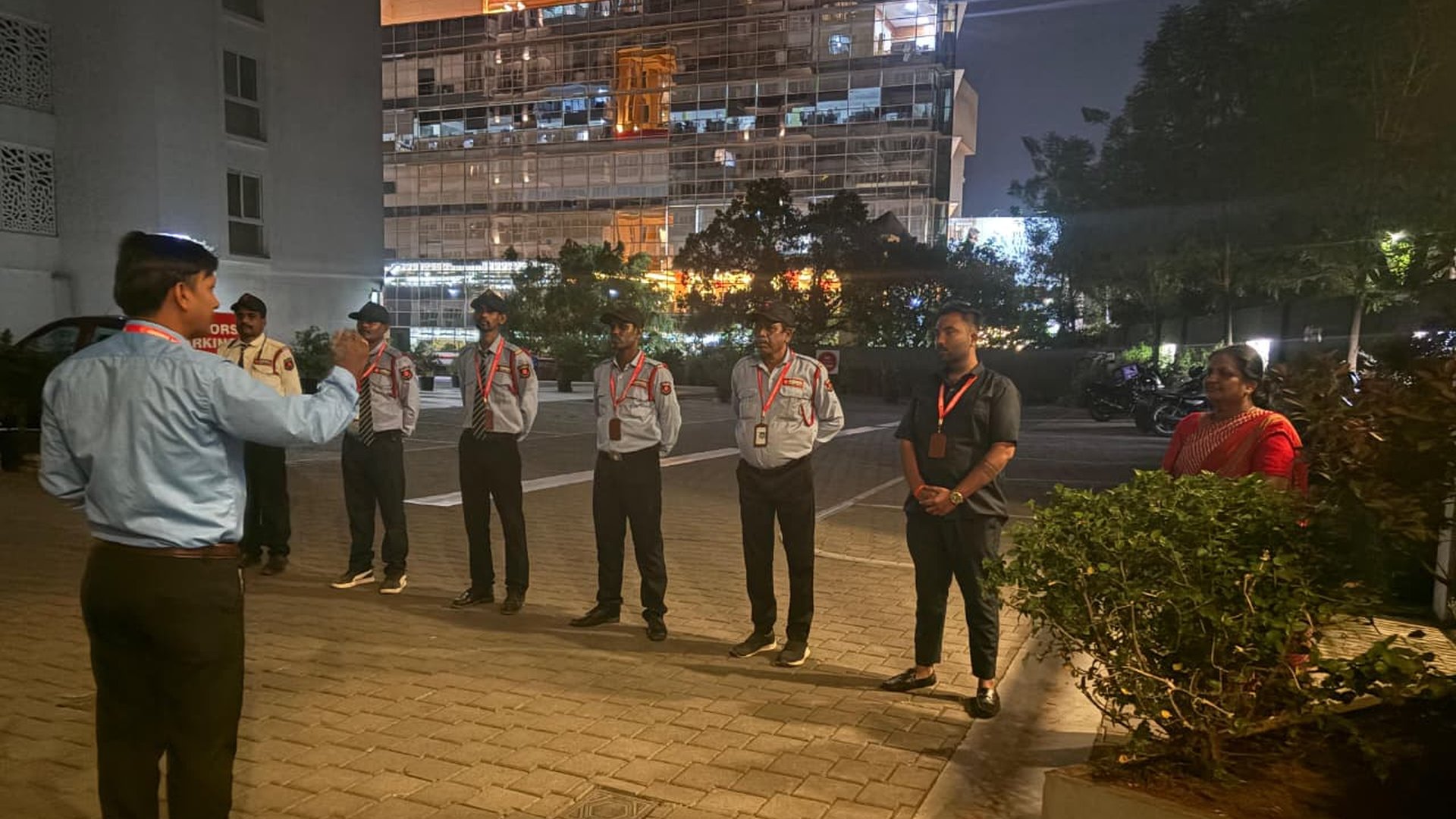 Assured Security Services team receiving a night briefing outside a client site